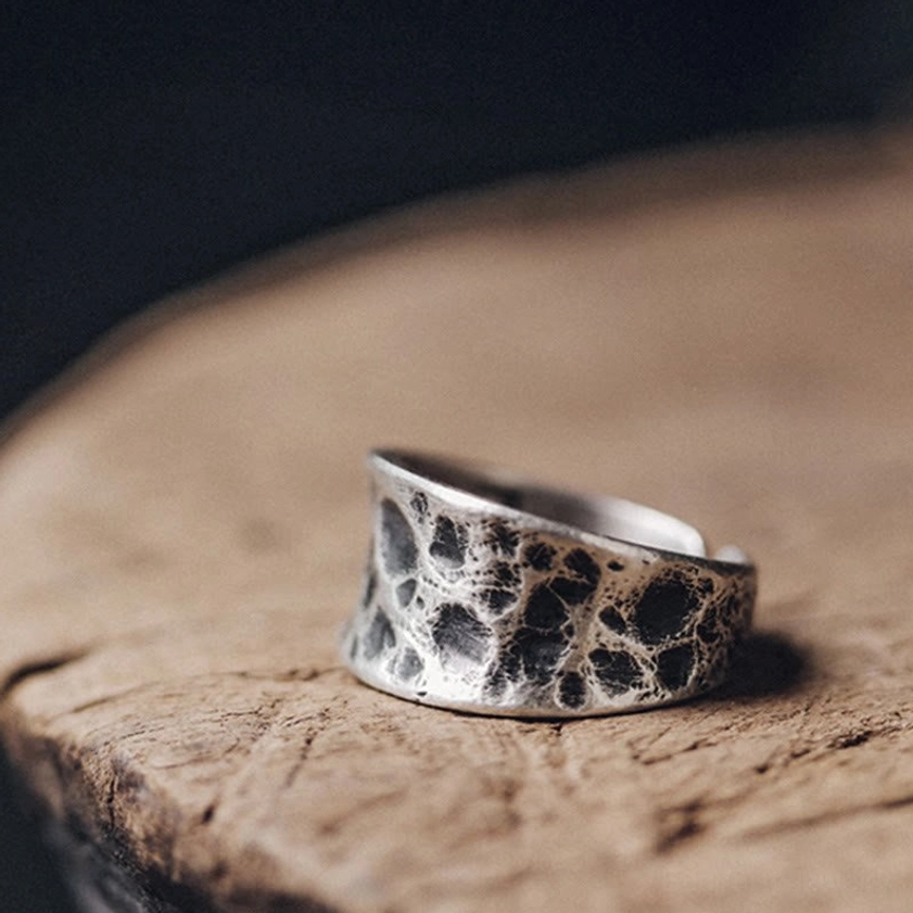 Adjustable sterling silver protection ring top down view displaying full bump texture pattern and antique finish