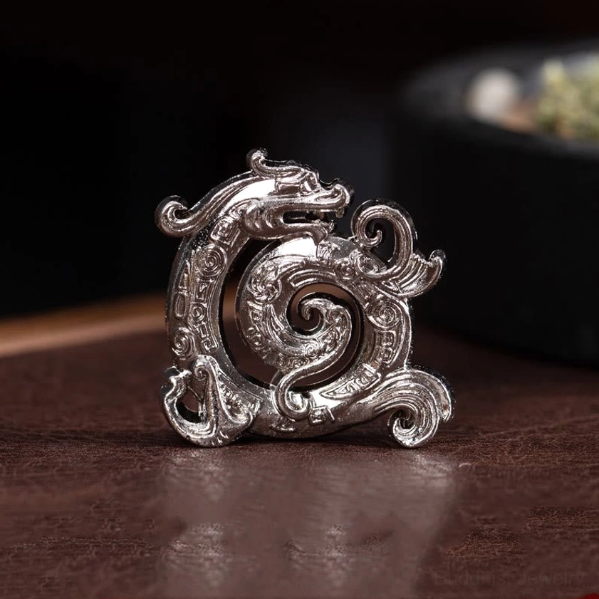 Silver dragon incense holder with matte finish and carved retro dragon details, eye-level shot on wooden table