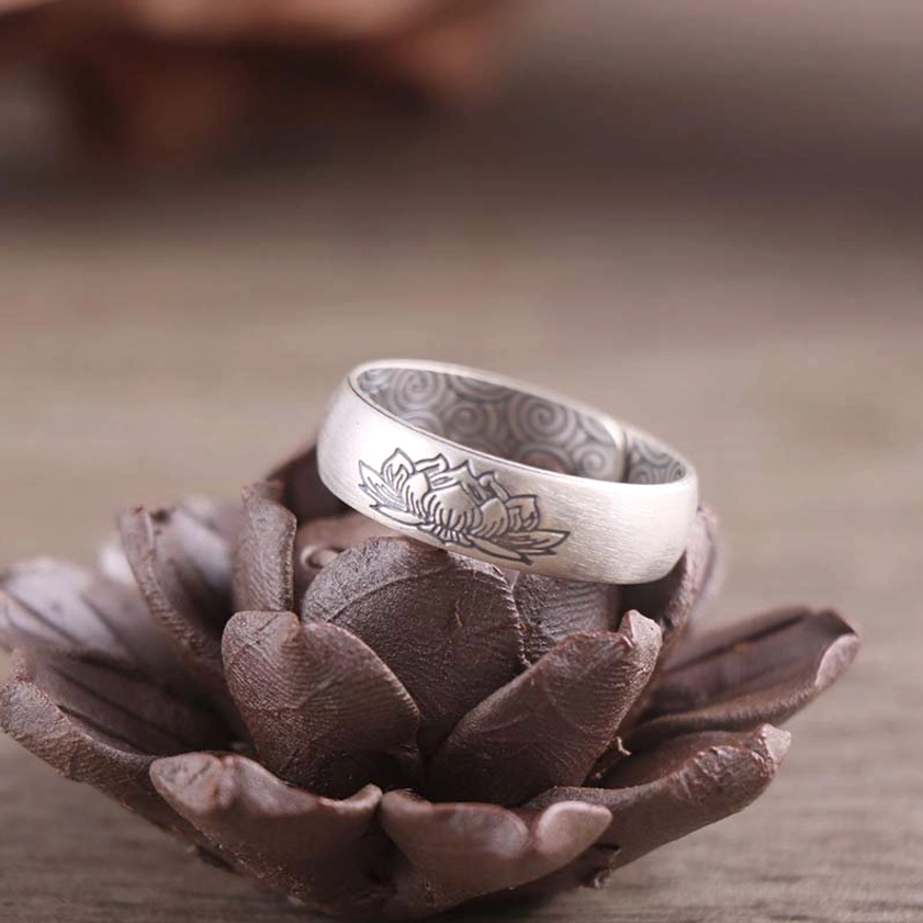 Silver elephant engraved open ring with protective Buddhist symbolism and matte finish, overhead view