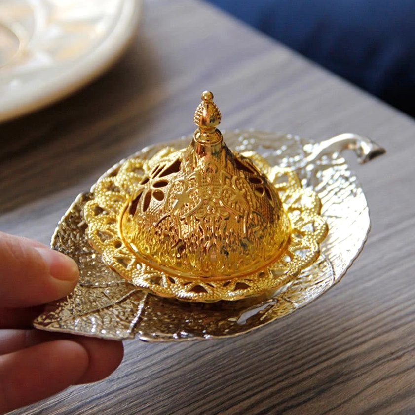 Silver leaf incense burner coaster with carved design and metallic finish for spiritual practice
