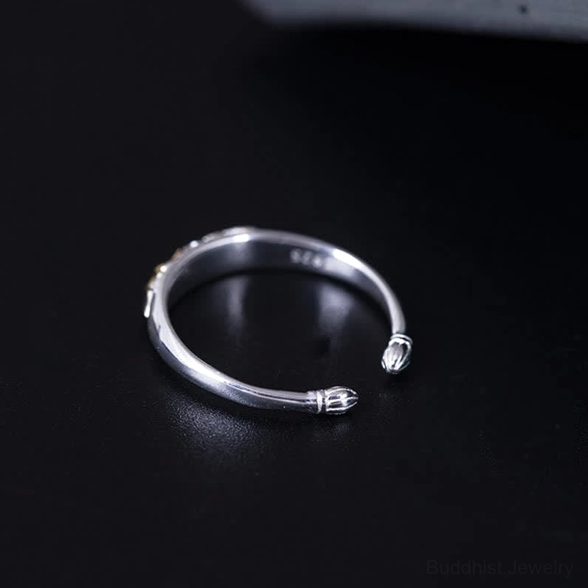 Simple sterling silver lotus ring top down perspective showing stamped mark and lotus-shaped open cuff design