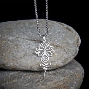Silver lotus unalome chakra necklace pendant on grey stone background, showing hollow filigree design and spiritual symbolism for enlightenment