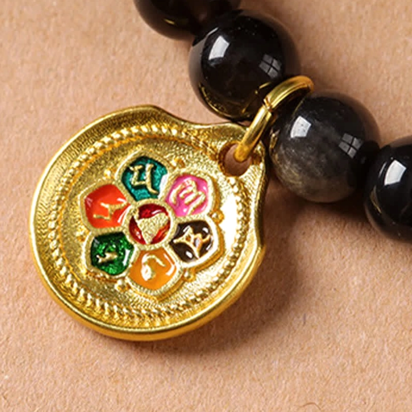 Silver Sheen Obsidian Buddhist necklace with Garuda pendant showing complete length and beading pattern