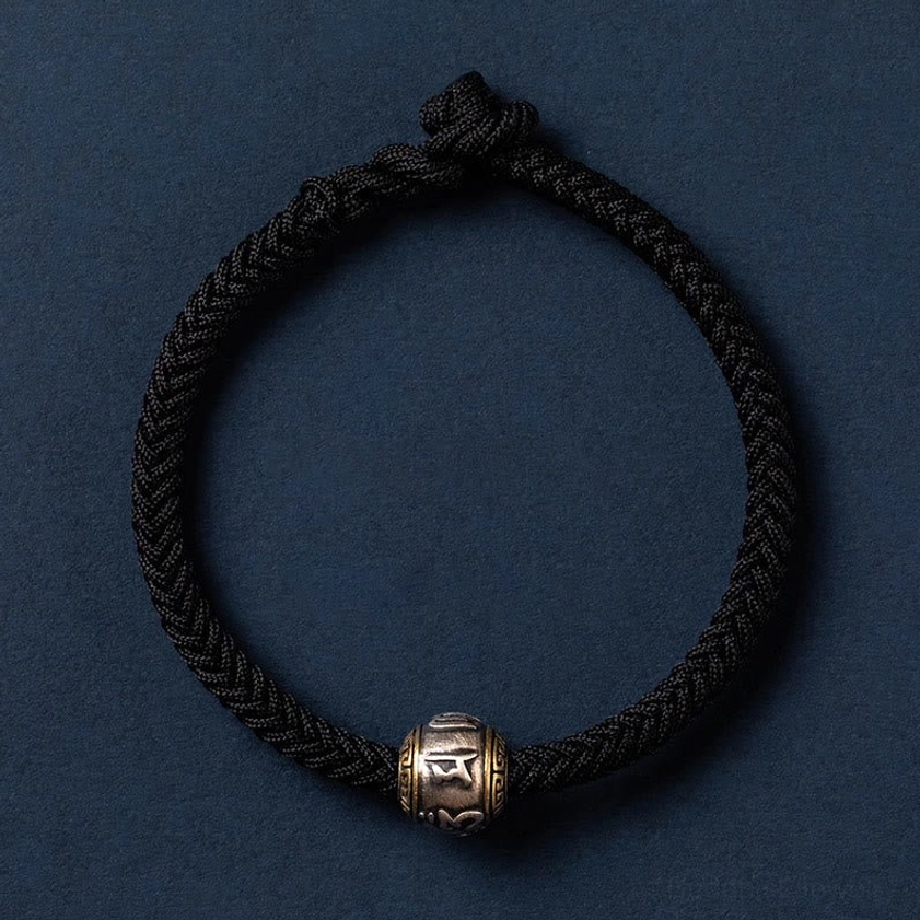 Simple style black Buddhist string bracelet with silver Om Mani Padme Hum charm, ideal for daily wear and spiritual practice