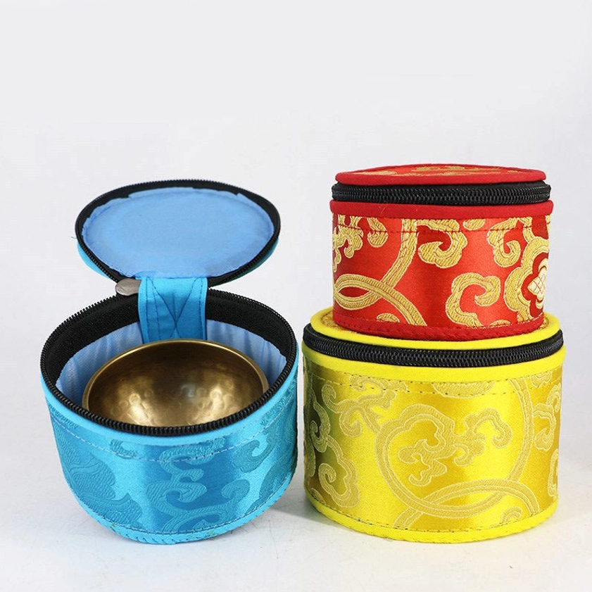 Buddhist singing bowl storage bag detail showing gold brocade embroidery and craftsmanship