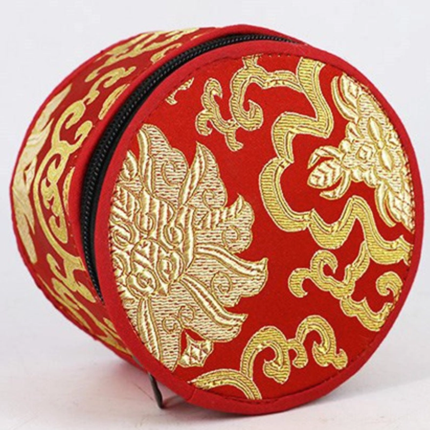 Embroidered singing bowl storage bag side view showing zipper and gold brocade pattern
