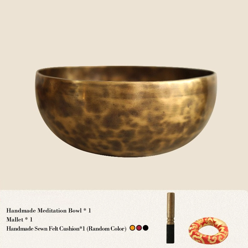Complete singing bowl meditation set flat lay including copper bowl mallet and cushion accessories