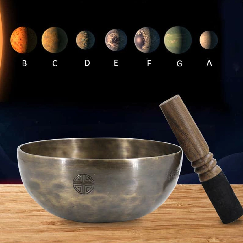 Full moon singing bowl set with wooden mallet and cushion on display with musical scale reference