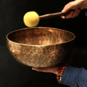 Handcrafted copper singing bowl side view with authentic hammer texture and traditional craftsmanship details