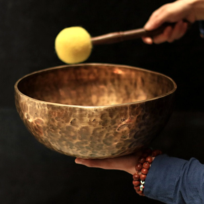 Handcrafted copper singing bowl side view with authentic hammer texture and traditional craftsmanship details