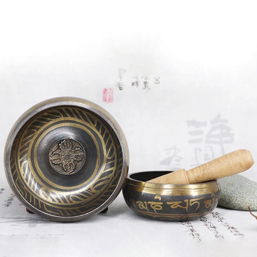 How to use Buddhist singing bowl instructional guide showing proper hand position, striker technique, and meditation practice methods