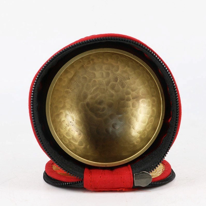 Singing bowl storage bag containing brass singing bowl, overhead view