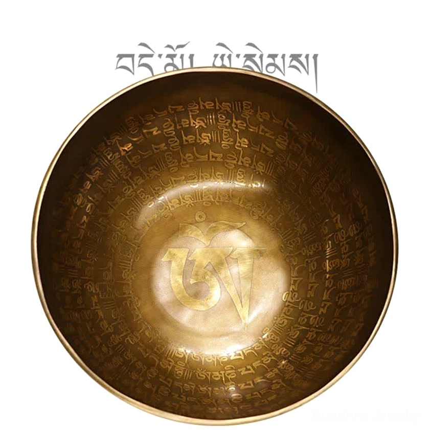Top-down view of Buddhist singing bowl interior with engraved sacred symbols and scriptures
