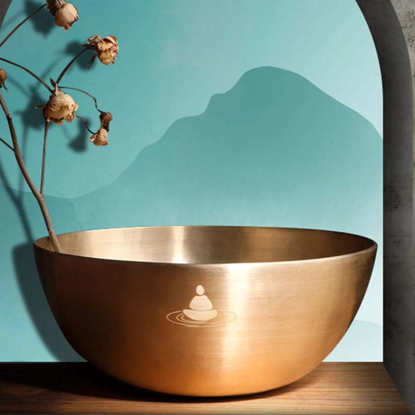 Singing bowl with cushion base and stabilizer, showing proper setup for chakra healing and meditation practice