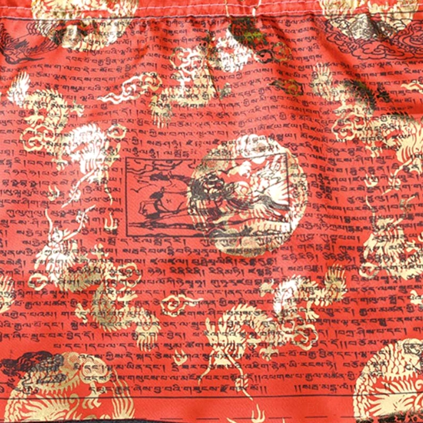 Single red Buddhist prayer flag covered with gold foil religious motifs and Tibetan mantras full coverage