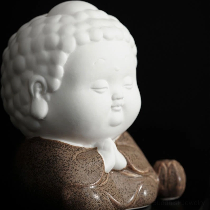 Close-up detail of sitting Buddha incense burner showing handcrafted ceramic finish and prayer meditation pose