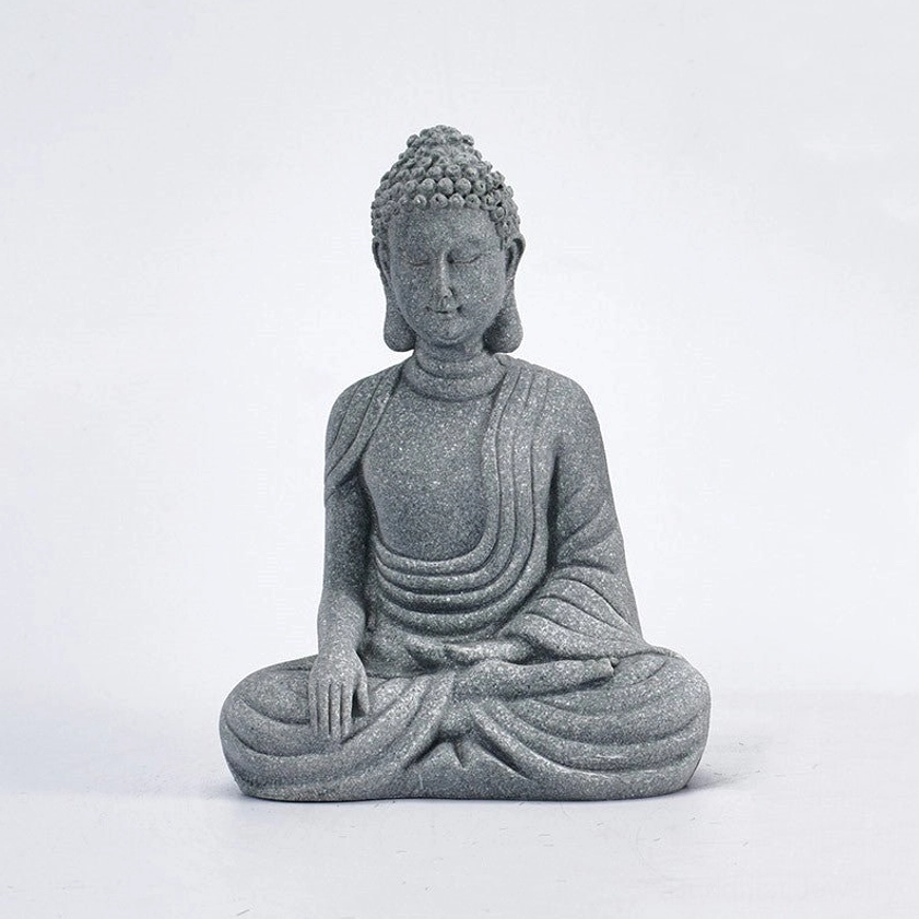 Natural sandstone sitting Buddha statue with symmetrical Buddhist design, direct frontal view on white background
