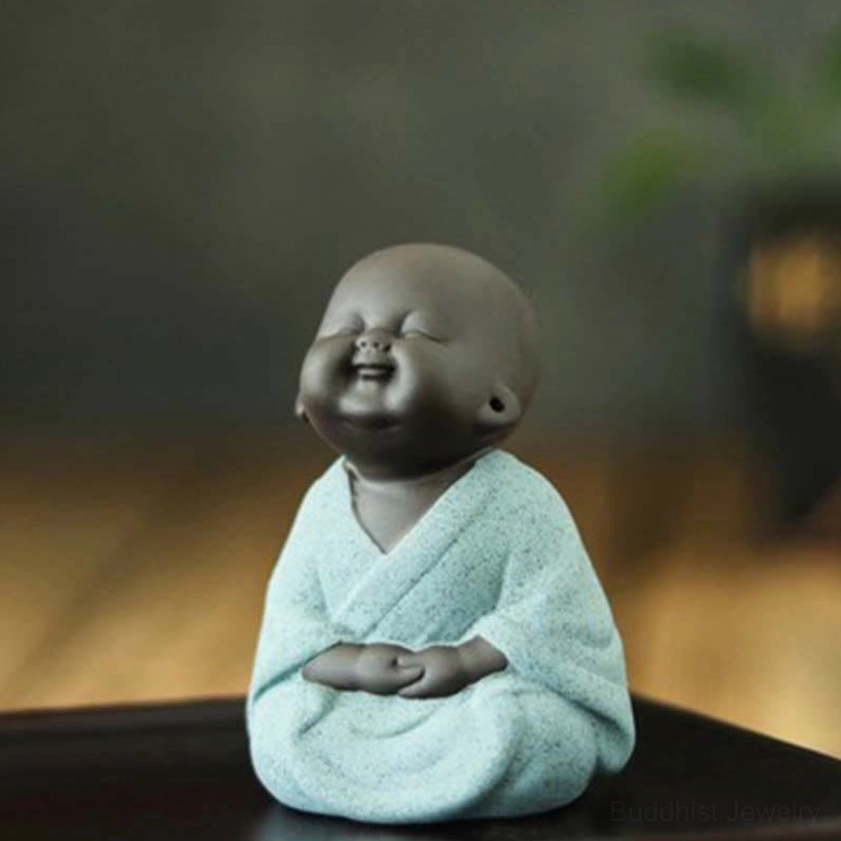 Sitting green little monk meditation statue, handcrafted Buddhist figurine for zen garden and altar display