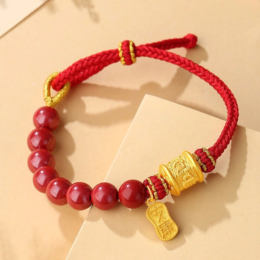 Six True Words mantra bracelet with adjustable red cord and engraved sterling silver barrel - top down display