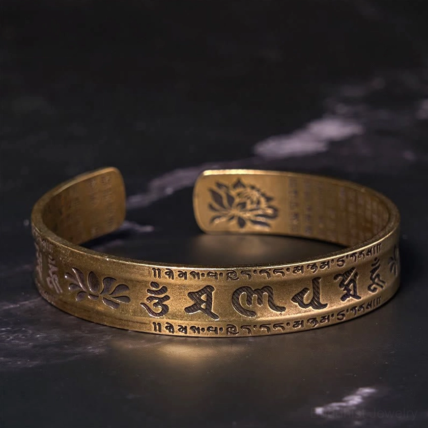 Six true words mantra brass bangle with detailed Sanskrit carving and decorative lotus motif
