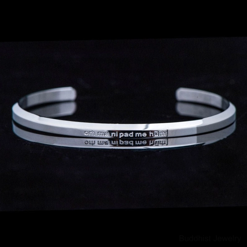 Silver titanium steel engraved om mani padme hum bracelet close-up
