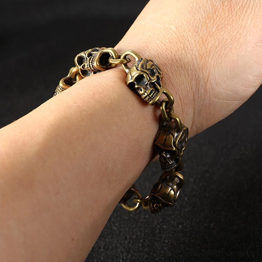 Skull bracelet worn on real human wrist showing fit and comfort - copper brass spiritual Buddhist charm bracelet