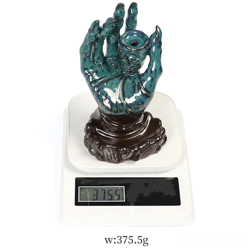 Ceramic skull hand backflow incense burner creating peaceful meditation ambiance