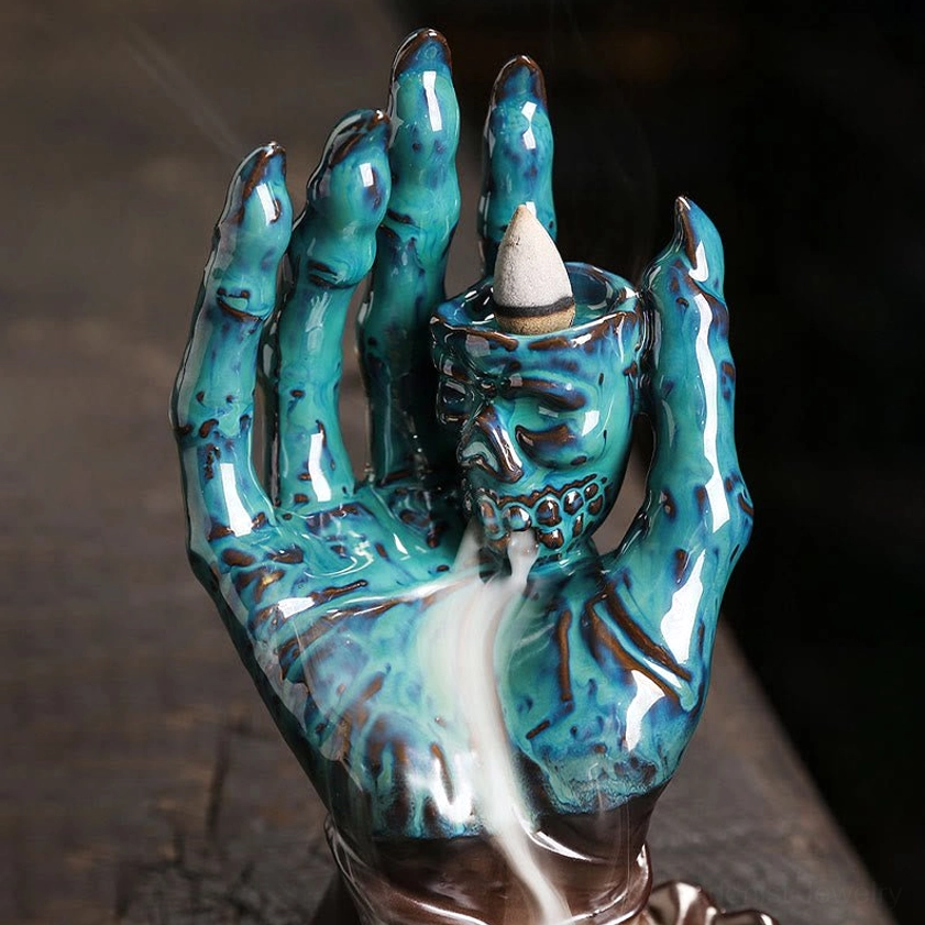 Skull hand backflow incense burner perfect for yoga rooms and meditation spaces