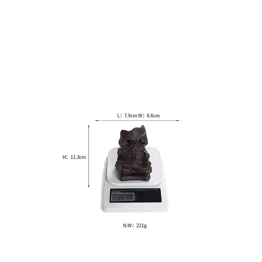 Purple clay skull incense burner lifestyle display showing meditation and spiritual wellness setup