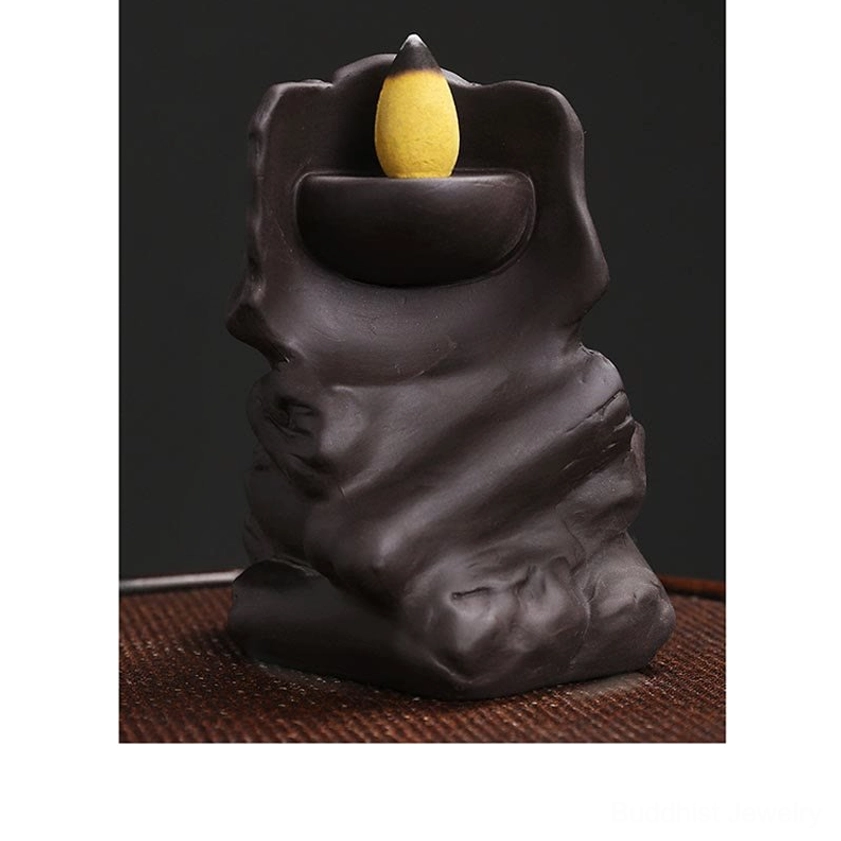 Purple clay skull incense burner front side view with cone incense on integrated tray
