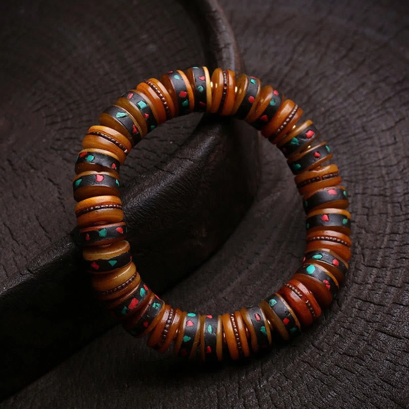 Skull variant bone bead bracelet featuring prominent carved skull centerpiece with protective spiritual energy design