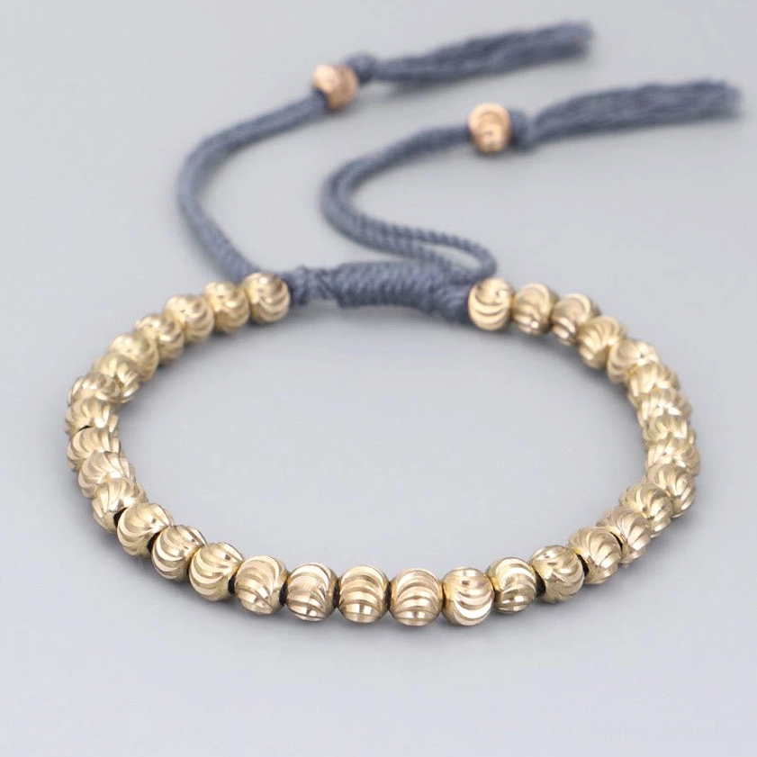 Sky blue handmade copper bead bracelet with ridged copper beads, adjustable string closure