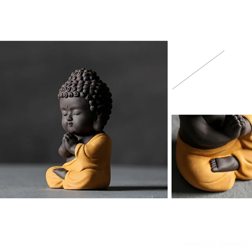 Small Buddha figurine showing exceptional artisanal detail work, natural clay construction for authentic spiritual home environment