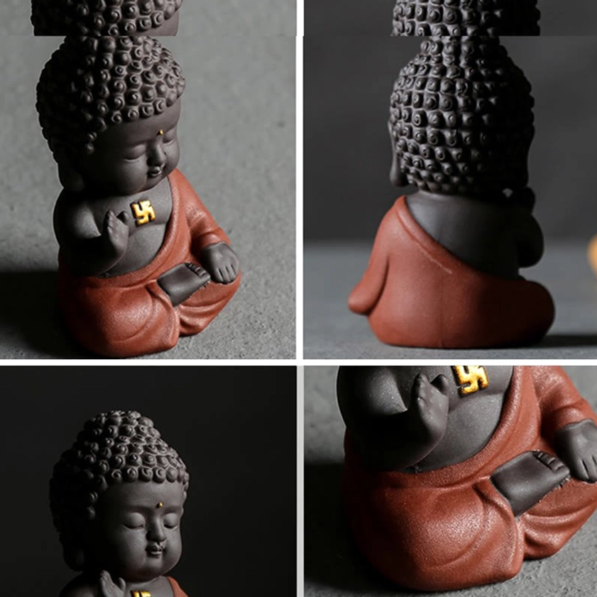 Close-up side view of small red-robed purple clay Buddha figurine showing golden swastika symbol, compact size perfect for desk decoration