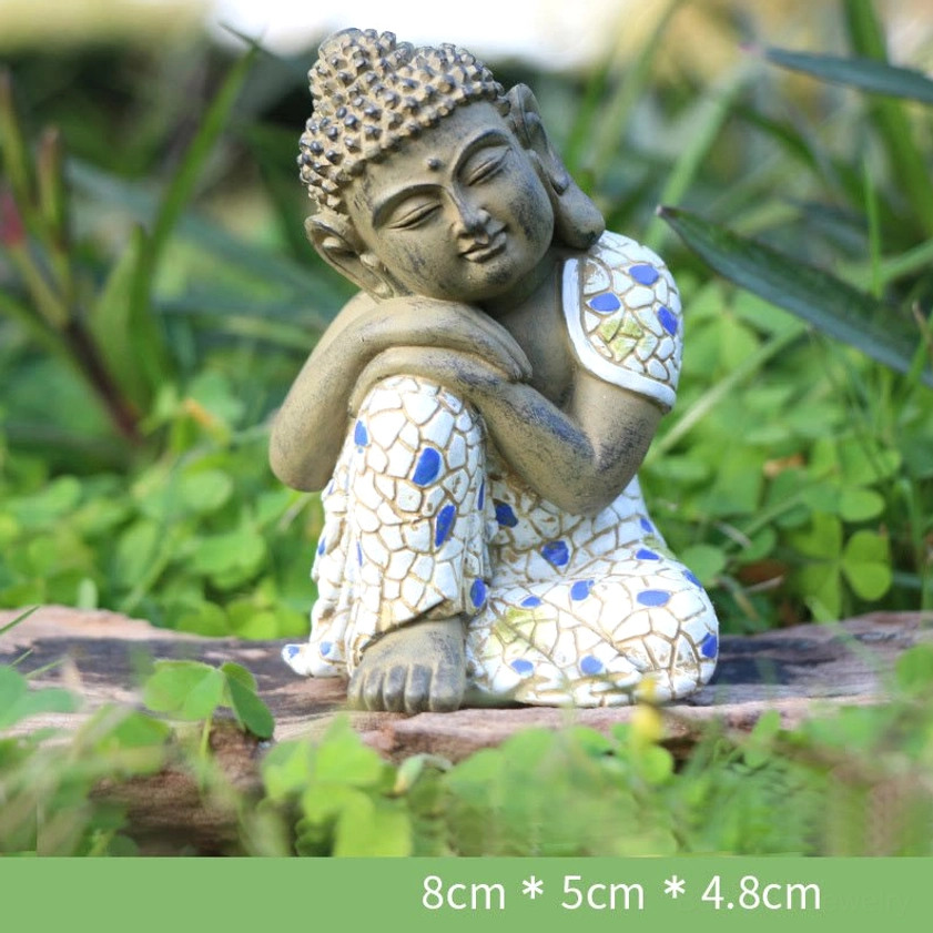 Small sleeping Buddha resin figurine with crossed arms, compact meditation statue for mindfulness spaces