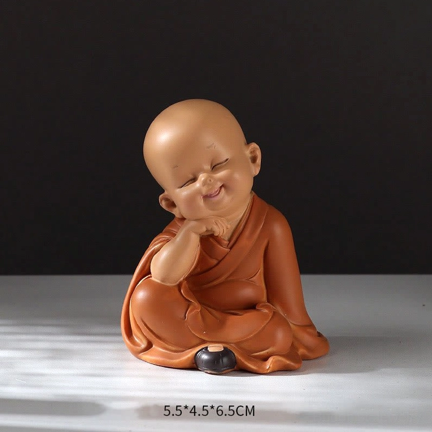 Smiling mini monk figurine with hand under cheek, joyful expression, 5.5 x 4.5 x 6.5cm spiritual home décor