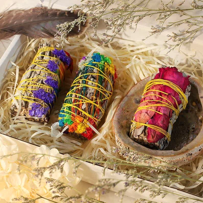Complete smudge stick ritual set arranged in wooden gift box with natural straw packaging