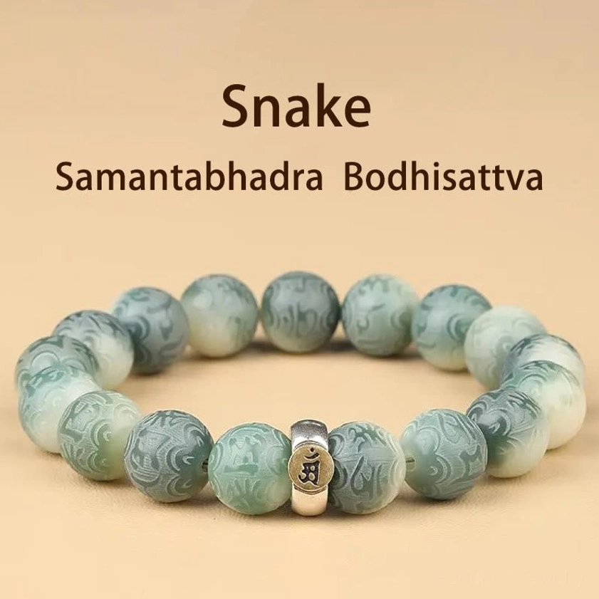 Snake zodiac natal Buddha bracelet front view showing engraved bodhi beads and guardian charm