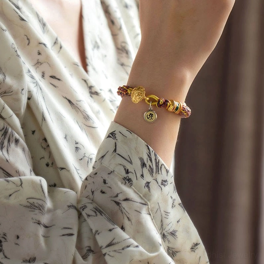 Snake zodiac guardian Buddha bracelet featuring engraved sterling silver charm and braided cord