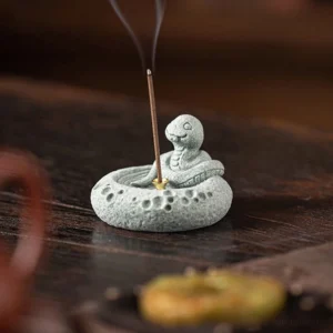 Snake zodiac incense burner handcrafted green sandstone with matte finish and crater embossments close-up