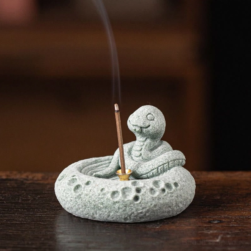 Snake zodiac incense burner side view with burning incense stick golden socket