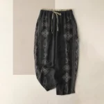 Women's spiritual harem pants with lotus vajra namaste om print, black organic cotton flat lay front view