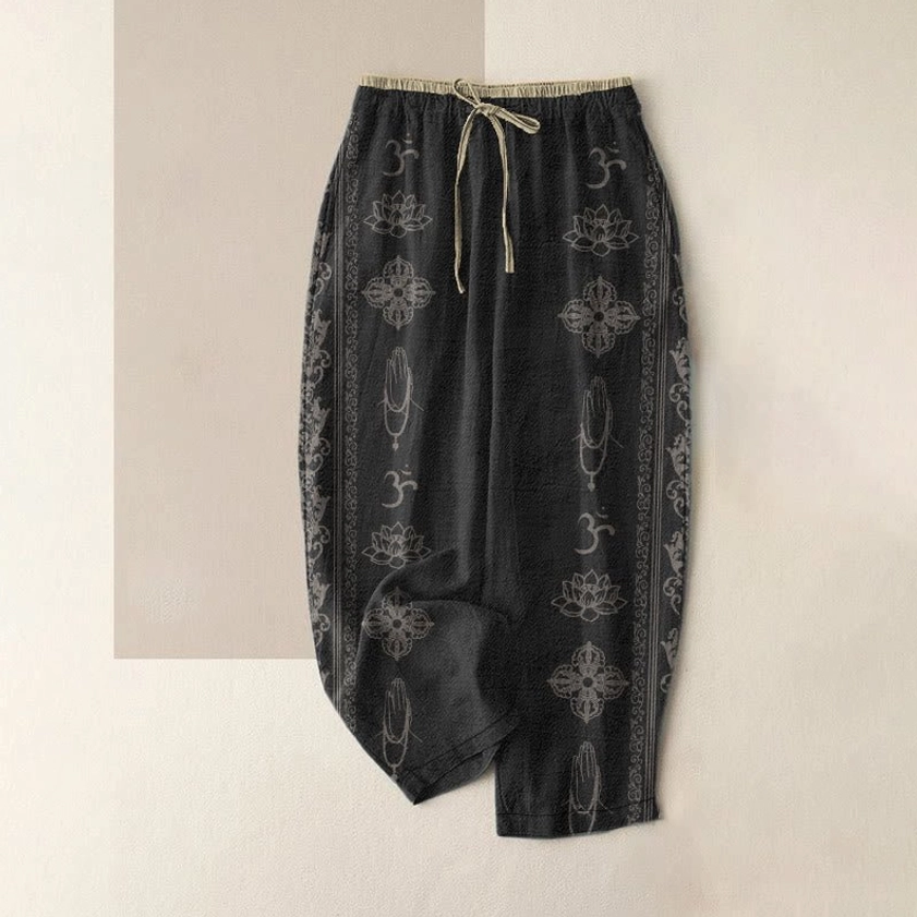 Women's spiritual harem pants with lotus vajra namaste om print, black organic cotton flat lay front view