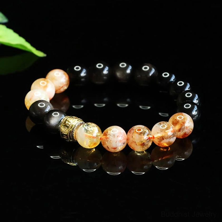 Handcrafted Om Mani Padme Hum bracelet with silver sheen obsidian and citrine stones featuring engraved spiritual spacer bead