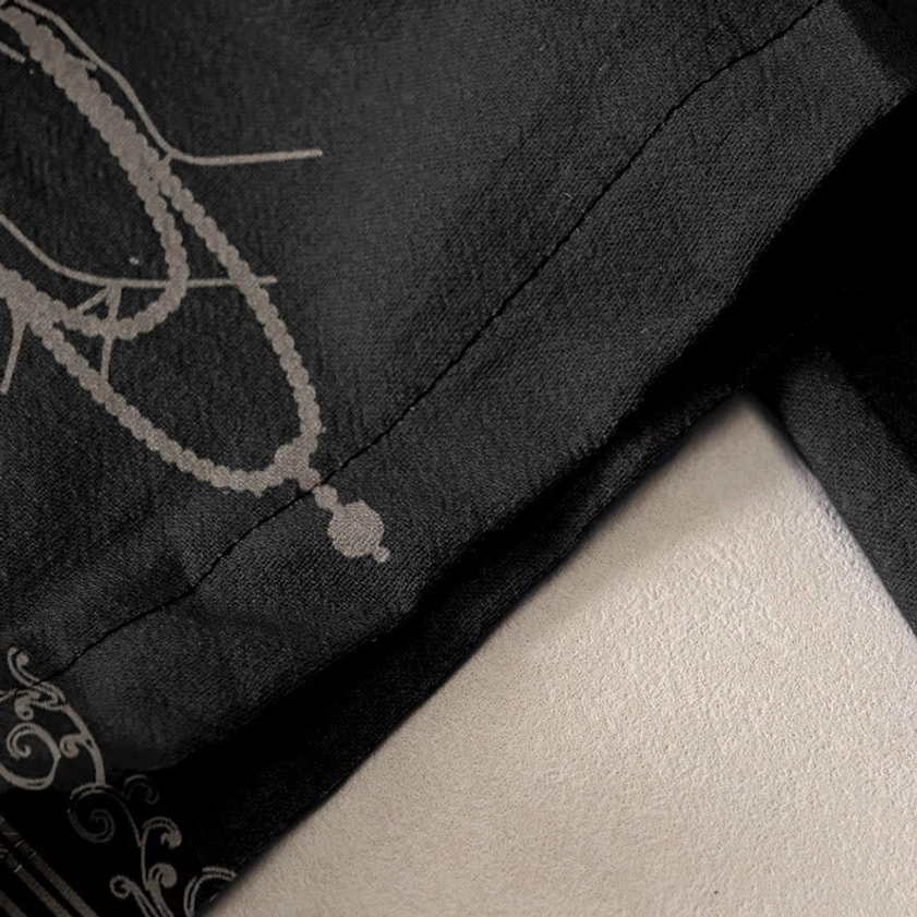 Fabric texture and hem detail of organic cotton harem pants with vajra print pattern