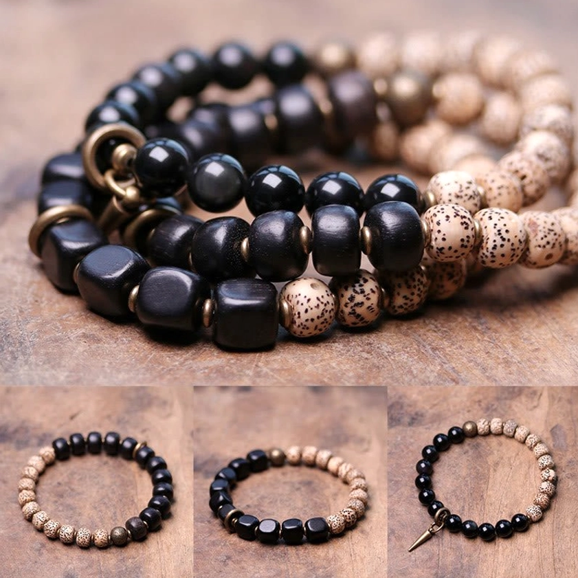 Stacked handmade Buddhist bracelets with bodhi seeds square ebony wood and obsidian beads overhead view