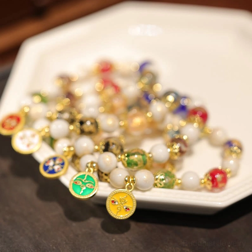 Stacked Buddhist wealth charm bracelets featuring various enamel deities and liuli glass beads on octagonal plate