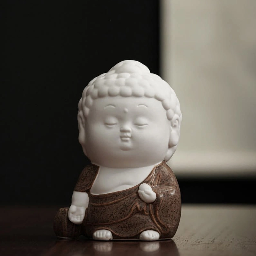 Standing Buddha ceramic incense burner in strength pose with white body and celadon glazed robes - full height view