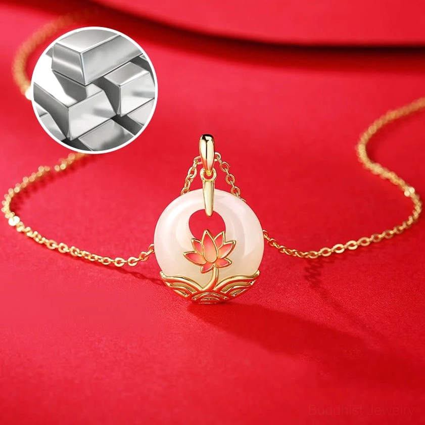 Sterling silver 925 material sample shown with hetian white jade lotus necklace on red fabric background