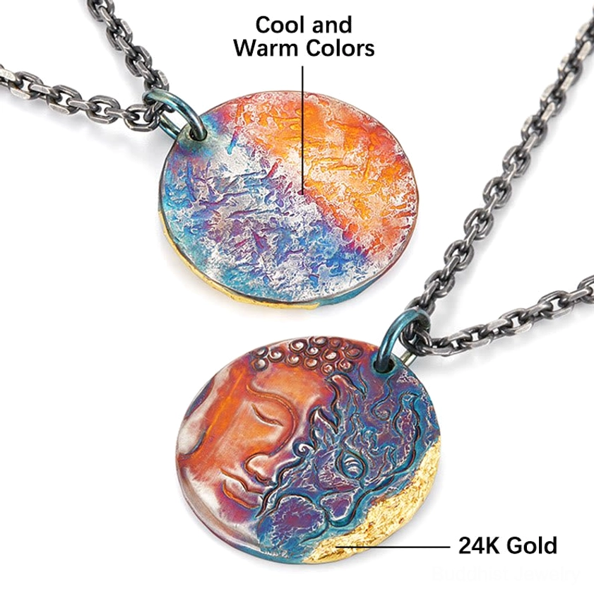 Overhead flat lay of two sterling silver Buddhist pendants with labeled color tones and 24K gold accents, showing both sides of craftsmanship